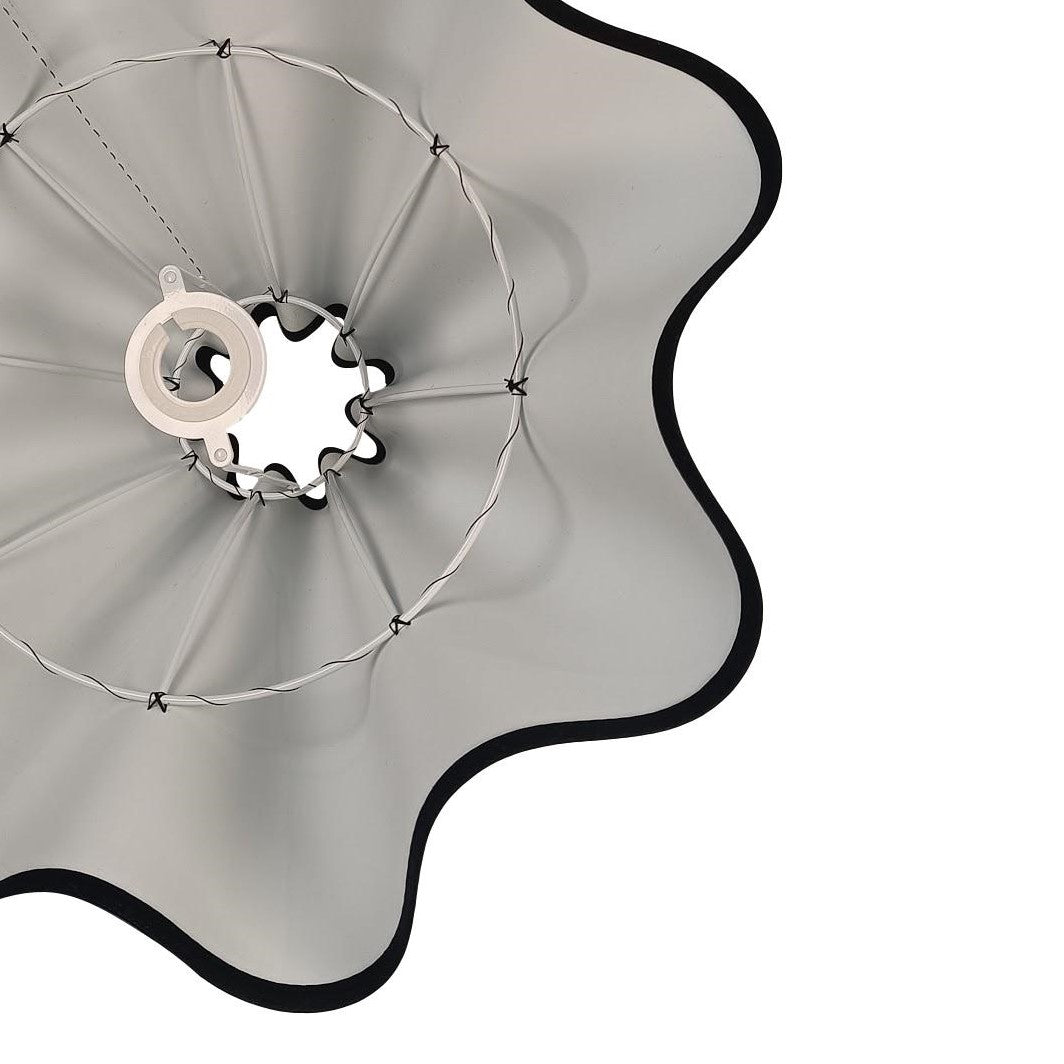 Munro and Kerr collaboration with a Considered Space black silk wavy scallop lampshade with black trim