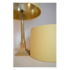 Munro and Kerr customers own material yellow linen tapered drum lampshade with mirror gold lining