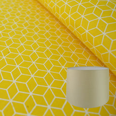 Munro and Kerr yellow geometric hand printed paper for a tapered drum lampshade
